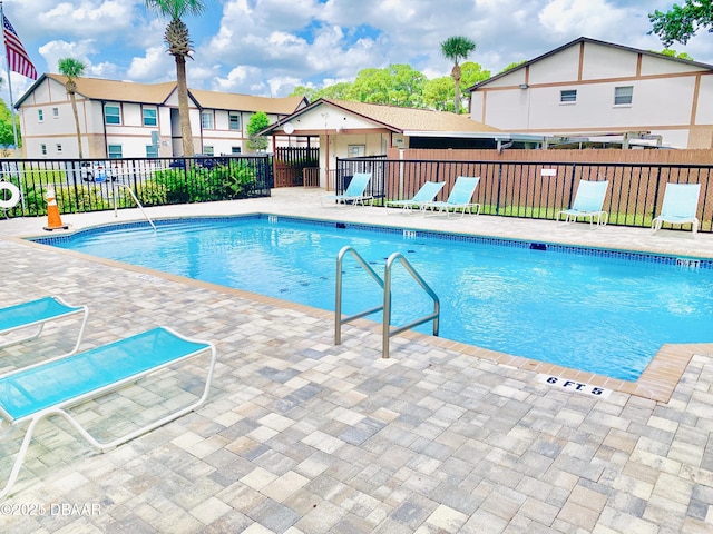 415 Banana Cay Dr Unit J, South Daytona, FL 32119 - community pool with a patio area
