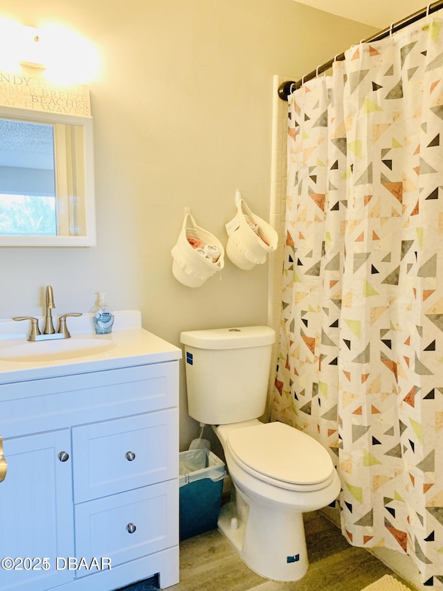 415 Banana Cay Dr Unit J, South Daytona, FL 32119 - bathroom with vanity, curtained shower, and wood finished floors