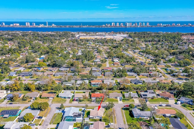 birds eye view of property with a water view