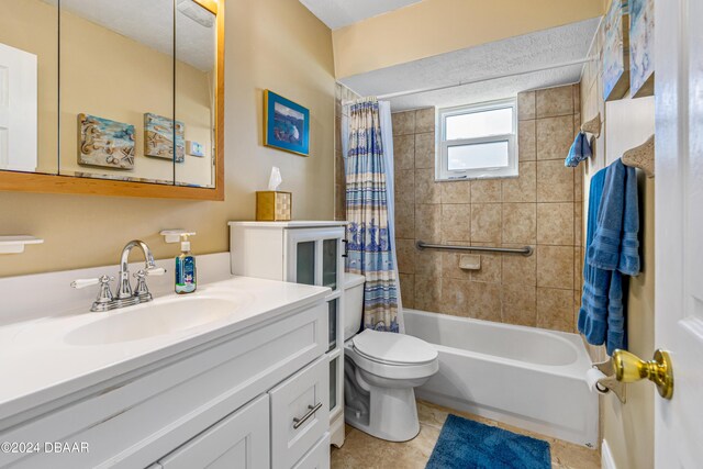 full bathroom with tile patterned flooring, vanity, shower / tub combo with curtain, and toilet