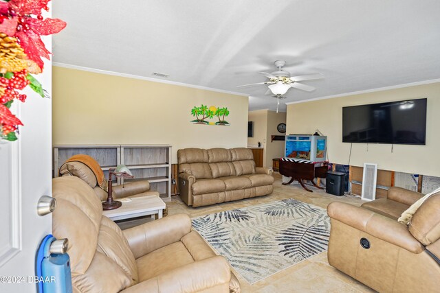 living room with ceiling fan and ornamental molding