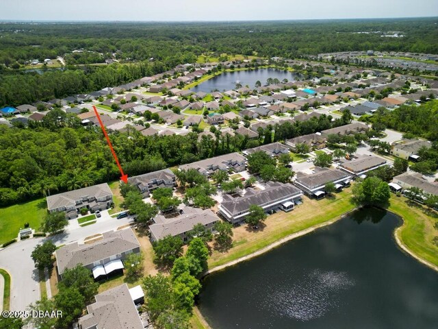 567 Mount Olympus Blvd, New Smyrna Beach, FL 32168 - aerial overview of property's location with a large body of water and nearby suburban area