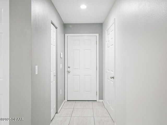 567 Mount Olympus Blvd, New Smyrna Beach, FL 32168 - entryway with light tile patterned flooring and baseboards