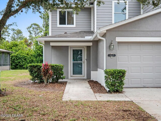 567 Mount Olympus Blvd, New Smyrna Beach, FL 32168 - doorway to property with a shingled roof, a garage, and a lawn