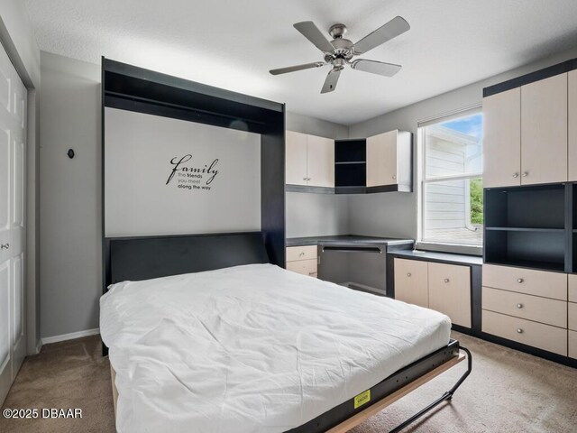 567 Mount Olympus Blvd, New Smyrna Beach, FL 32168 - bedroom with light carpet, baseboards, and a ceiling fan