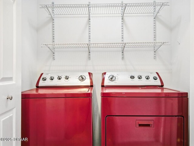 567 Mount Olympus Blvd, New Smyrna Beach, FL 32168 - clothes washing area featuring separate washer and dryer