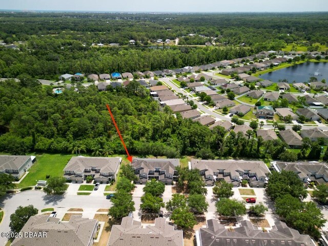 567 Mount Olympus Blvd, New Smyrna Beach, FL 32168 - aerial view of property's location with a forest, nearby suburban area, and a large body of water