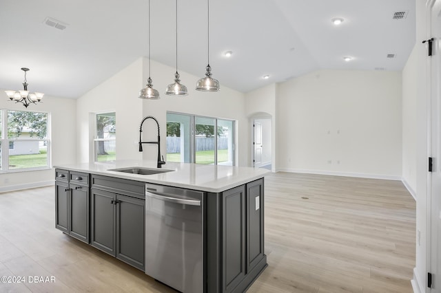 111 Bird Of Paradise Dr, Palm Coast, FL 32137 - kitchen featuring stainless steel dishwasher, a sink, vaulted ceiling, arched walkways, and light countertops