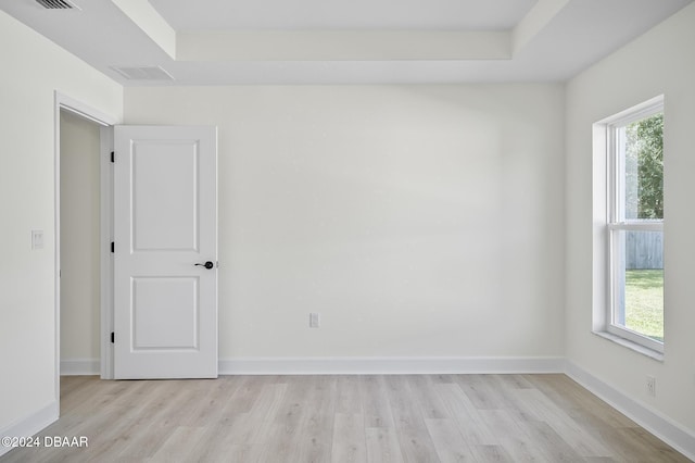 111 Bird Of Paradise Dr, Palm Coast, FL 32137 - spare room featuring light wood-style flooring, plenty of natural light, and baseboards