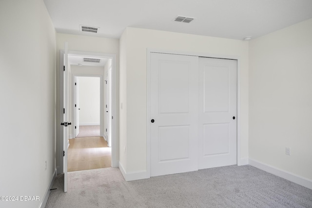 111 Bird Of Paradise Dr, Palm Coast, FL 32137 - unfurnished bedroom featuring carpet floors, a closet, and baseboards