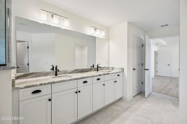 bathroom with vanity and hardwood / wood-style floors