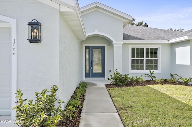 111 Bird Of Paradise Dr, Palm Coast, FL 32137 - doorway to property with roof with shingles, a lawn, and stucco siding
