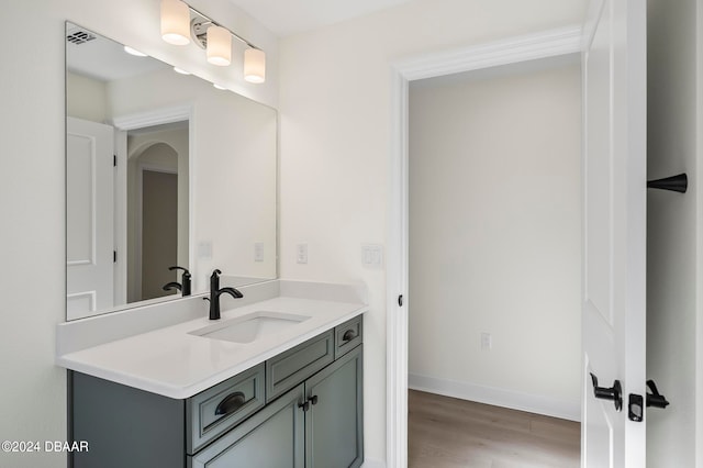 bathroom featuring hardwood / wood-style floors and vanity