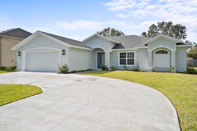 ranch-style house with a garage and a front lawn