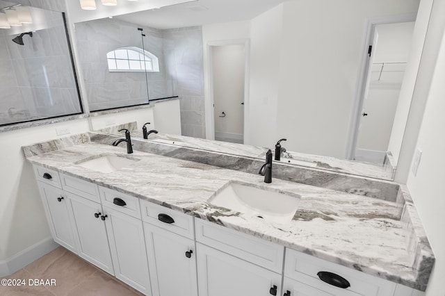 bathroom featuring tile patterned flooring and vanity