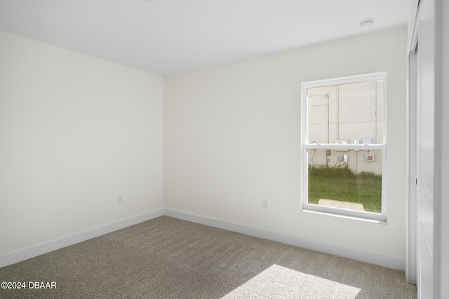 111 Bird Of Paradise Dr, Palm Coast, FL 32137 - carpeted spare room featuring baseboards