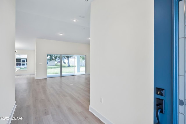 hall with light hardwood / wood-style floors