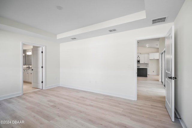 spare room featuring light hardwood / wood-style flooring