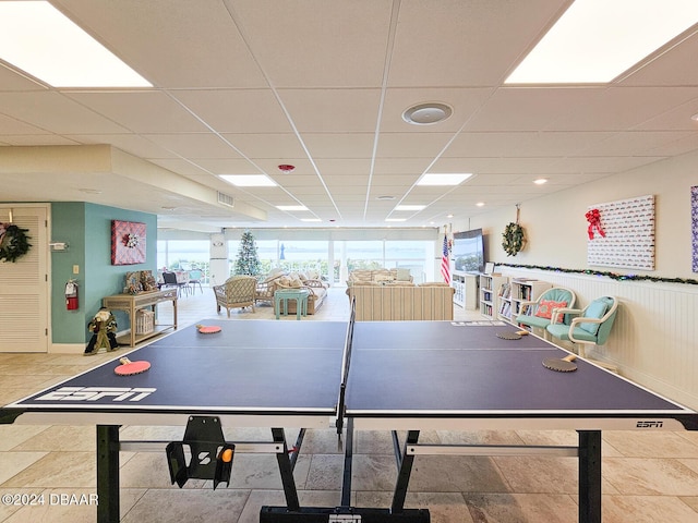 playroom featuring a paneled ceiling