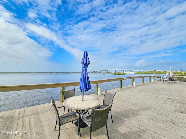 dock area with a deck with water view