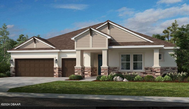 view of front of house featuring a garage and a front lawn