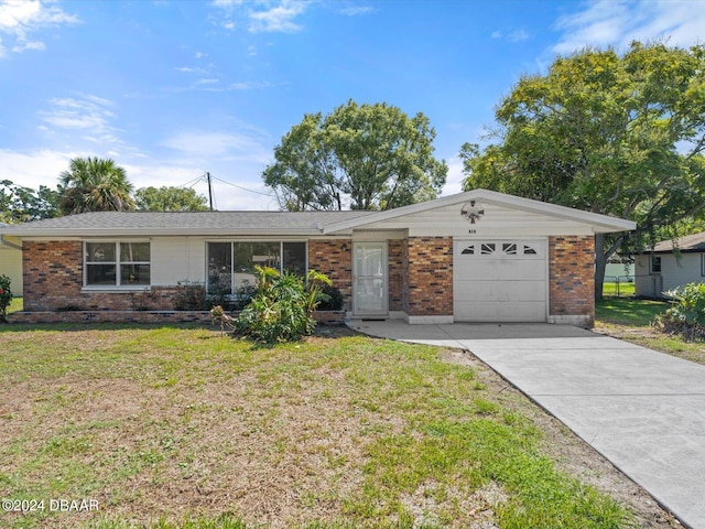 single story home with a garage and a front yard