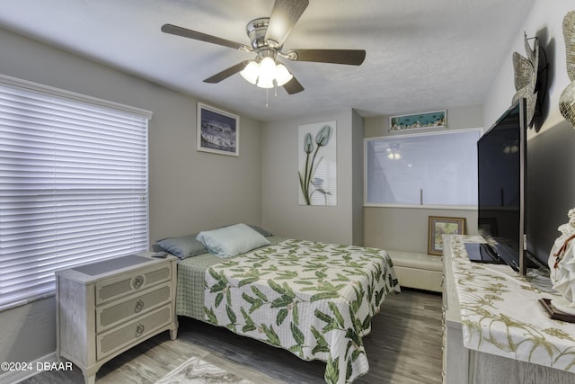 bedroom featuring hardwood / wood-style floors and ceiling fan