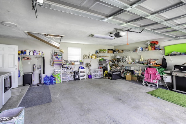 garage featuring a garage door opener and washer and clothes dryer