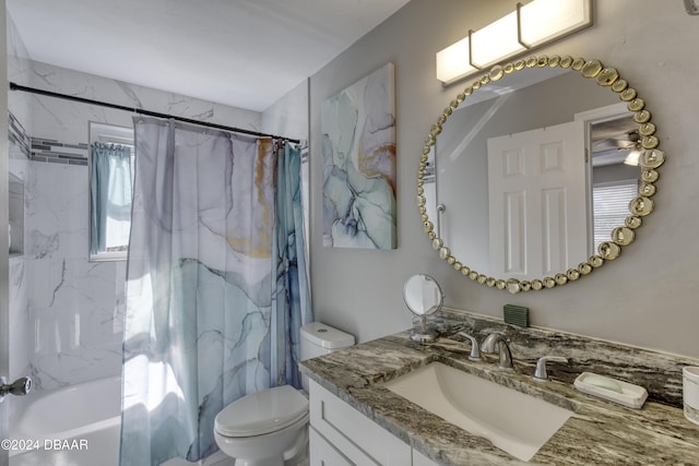 full bathroom with vanity, shower / bath combo, and toilet