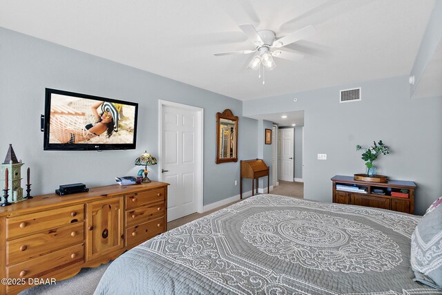 3145 S Atlantic Ave Unit 504, Daytona Beach Shores, FL 32118 - bedroom featuring light carpet and ceiling fan