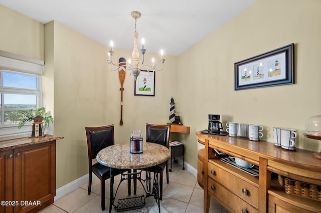 3145 S Atlantic Ave Unit 504, Daytona Beach Shores, FL 32118 - dining space with a chandelier and light tile patterned floors