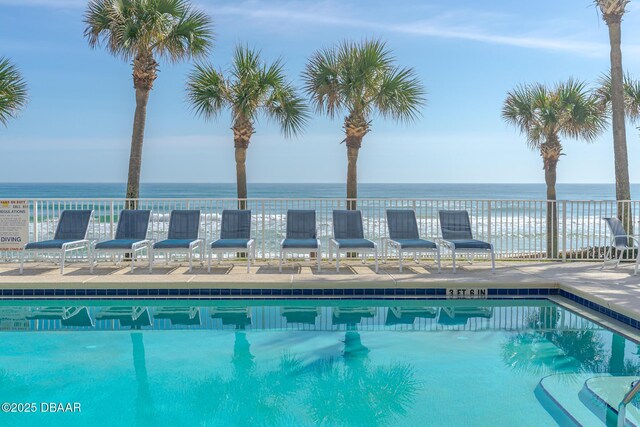 3145 S Atlantic Ave Unit 504, Daytona Beach Shores, FL 32118 - community pool featuring a water view and a patio area