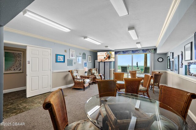3145 S Atlantic Ave Unit 504, Daytona Beach Shores, FL 32118 - dining room with crown molding, a textured ceiling, and carpet flooring