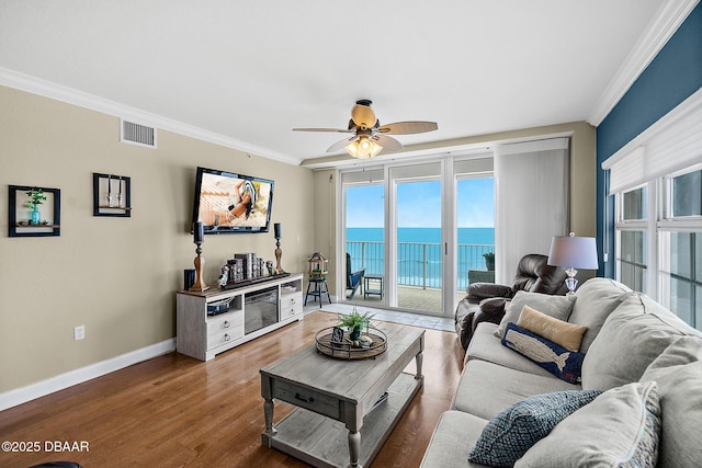 3145 S Atlantic Ave Unit 504, Daytona Beach Shores, FL 32118 - living area with crown molding, a ceiling fan, and wood finished floors
