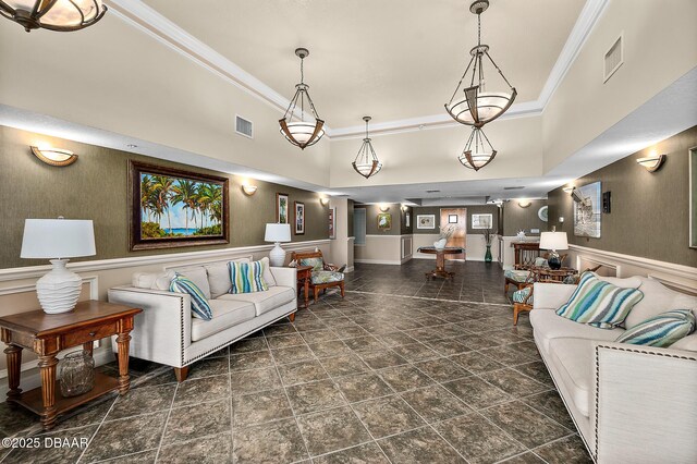 3145 S Atlantic Ave Unit 504, Daytona Beach Shores, FL 32118 - living room with stone finish floors, ornamental molding, a wainscoted wall, and a towering ceiling