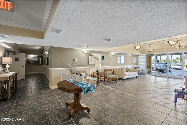 3145 S Atlantic Ave Unit 504, Daytona Beach Shores, FL 32118 - building lobby with crown molding and a textured ceiling
