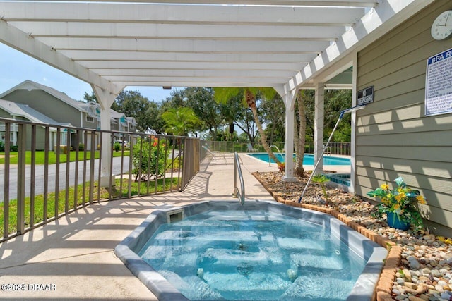 view of pool featuring a hot tub and a pergola