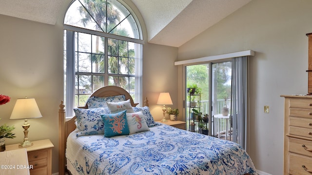 bedroom featuring vaulted ceiling, access to exterior, and a textured ceiling