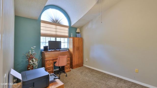 carpeted home office with vaulted ceiling and a textured ceiling