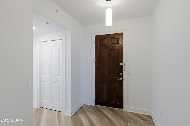 foyer entrance with light wood-type flooring