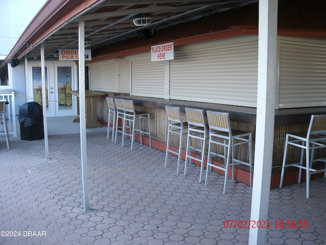 view of patio with an outdoor bar and french doors