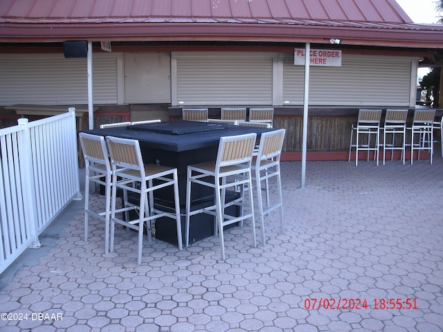 view of patio featuring an outdoor bar