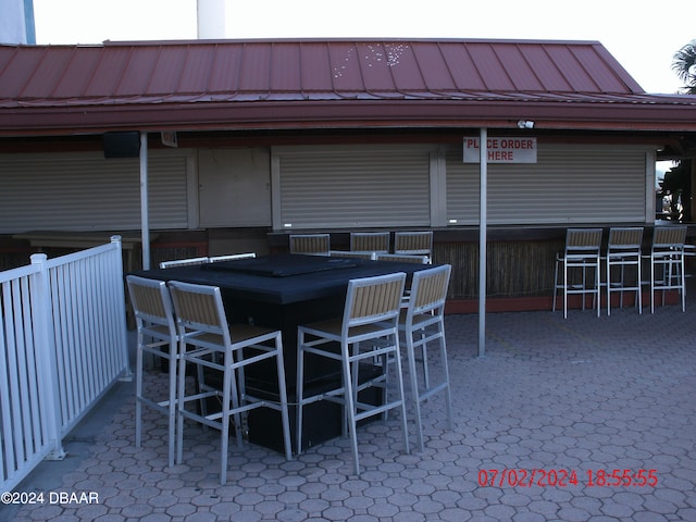 view of patio with exterior bar