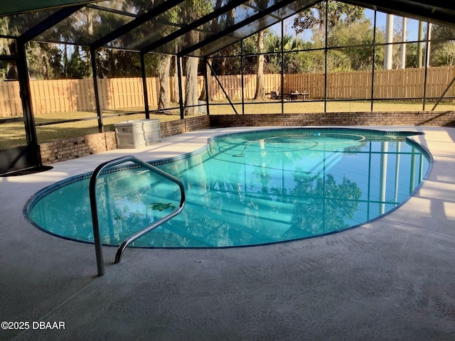 view of pool with a lanai and a patio