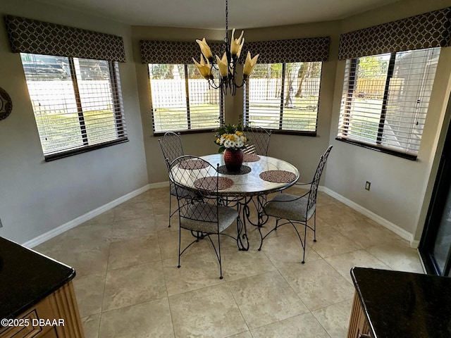 dining space featuring an inviting chandelier and light tile patterned floors