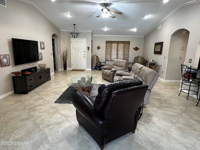 living room featuring ornamental molding, lofted ceiling, and ceiling fan