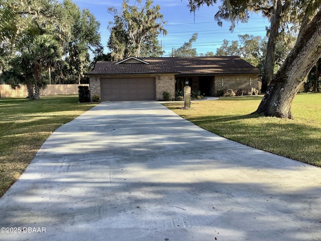 ranch-style house with a garage and a front lawn