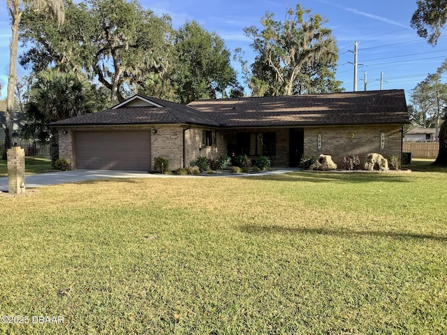 ranch-style house featuring a garage and a front yard