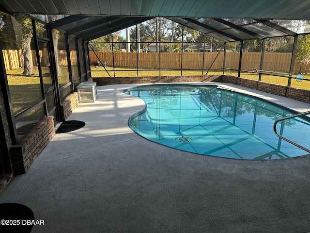 view of pool with a lanai and a patio