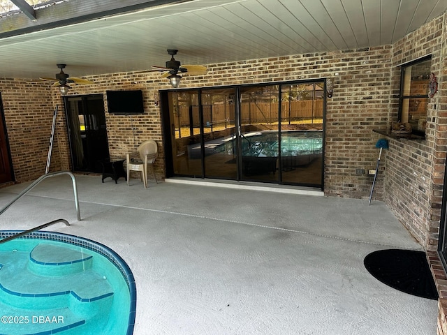 view of pool featuring ceiling fan and a patio